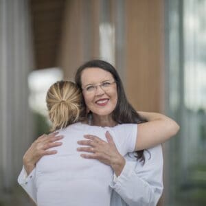 Helena hugging a patient
